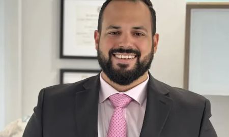 John R. De La Vega, Esq.
